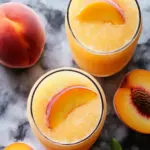refreshing frozen peach lemonade - featured image